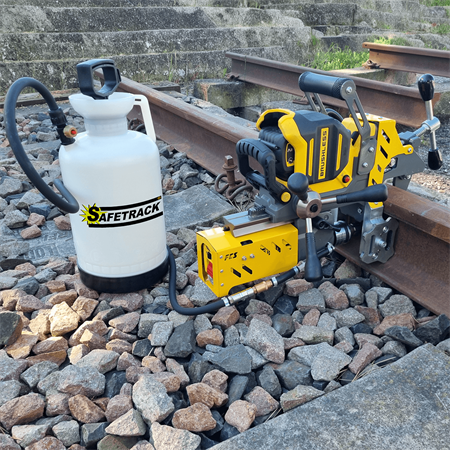 Rail drilling machines